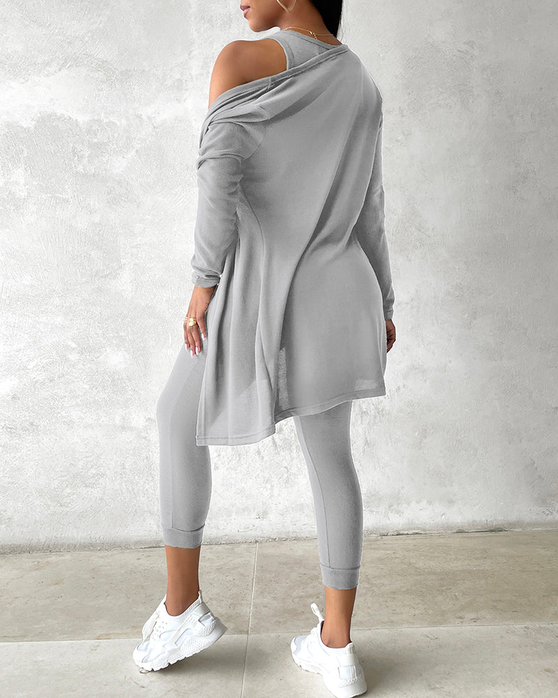 Light gray tank top, long sleeve coat, and pants from KOAD'CLO’s 3-Piece Lounge Set.