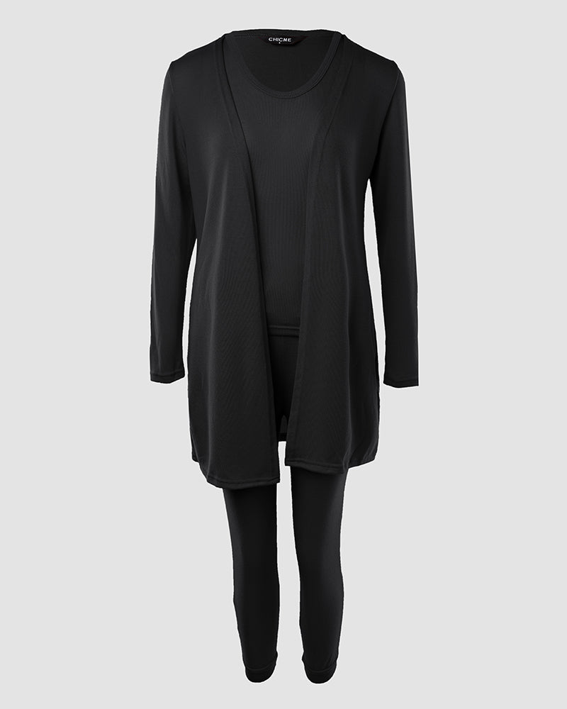 A black tank top, long sleeve coat, and pants from the KOAD'CLO set.