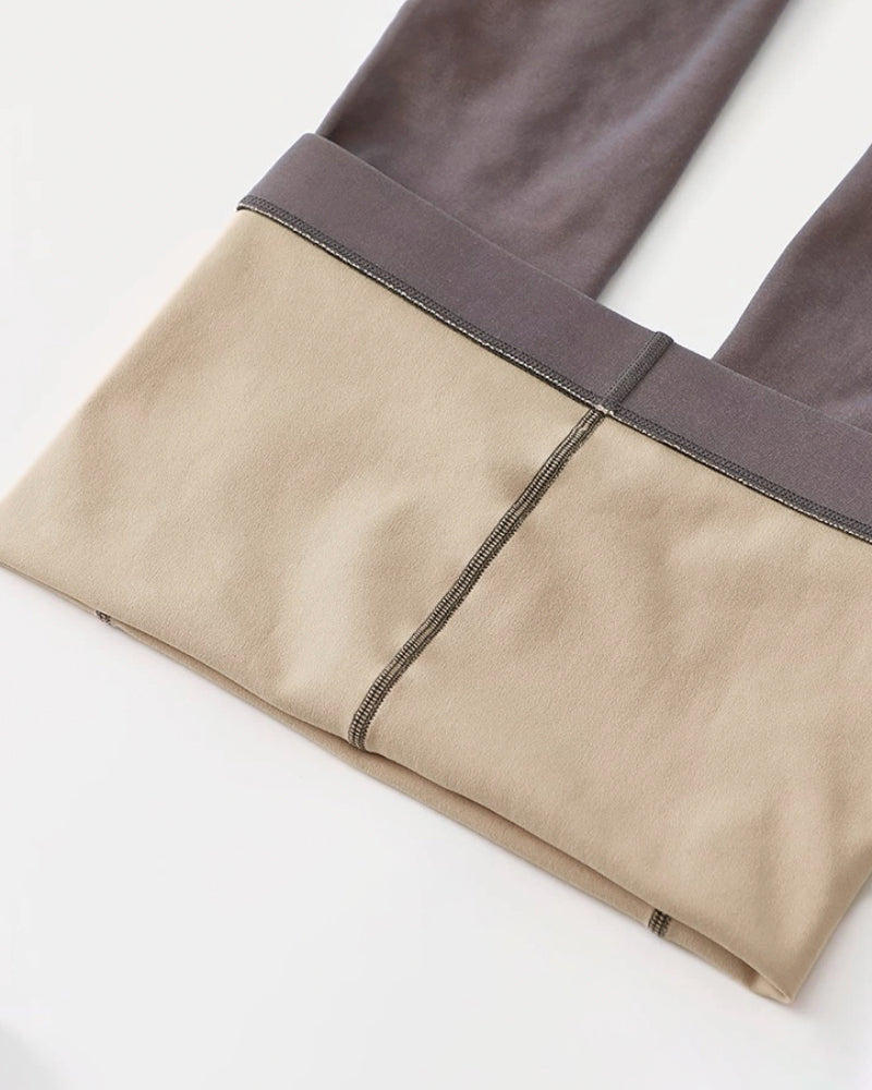 Gray and beige color-blocked high waist sheer tights with reinforced toes and visible seams.