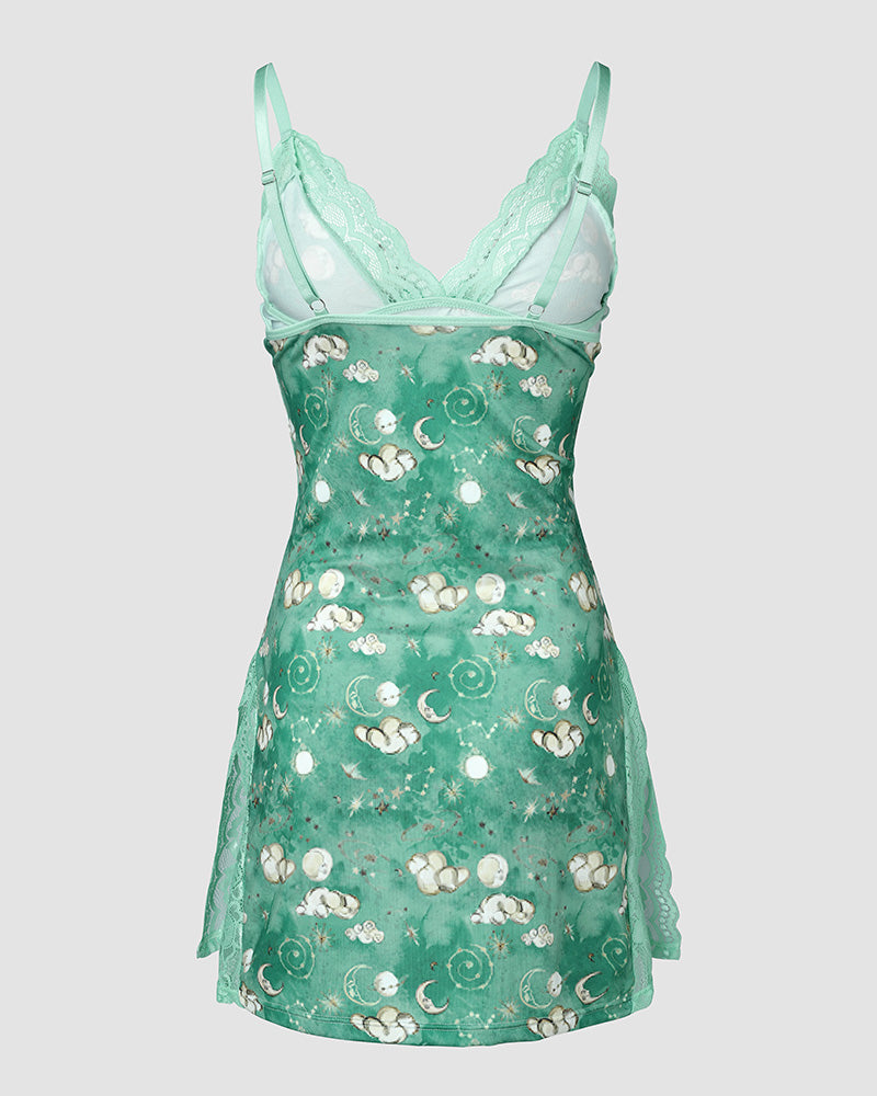 Sheer green lace sleep dress with spaghetti straps, deep V-neck, and whimsical prints.
