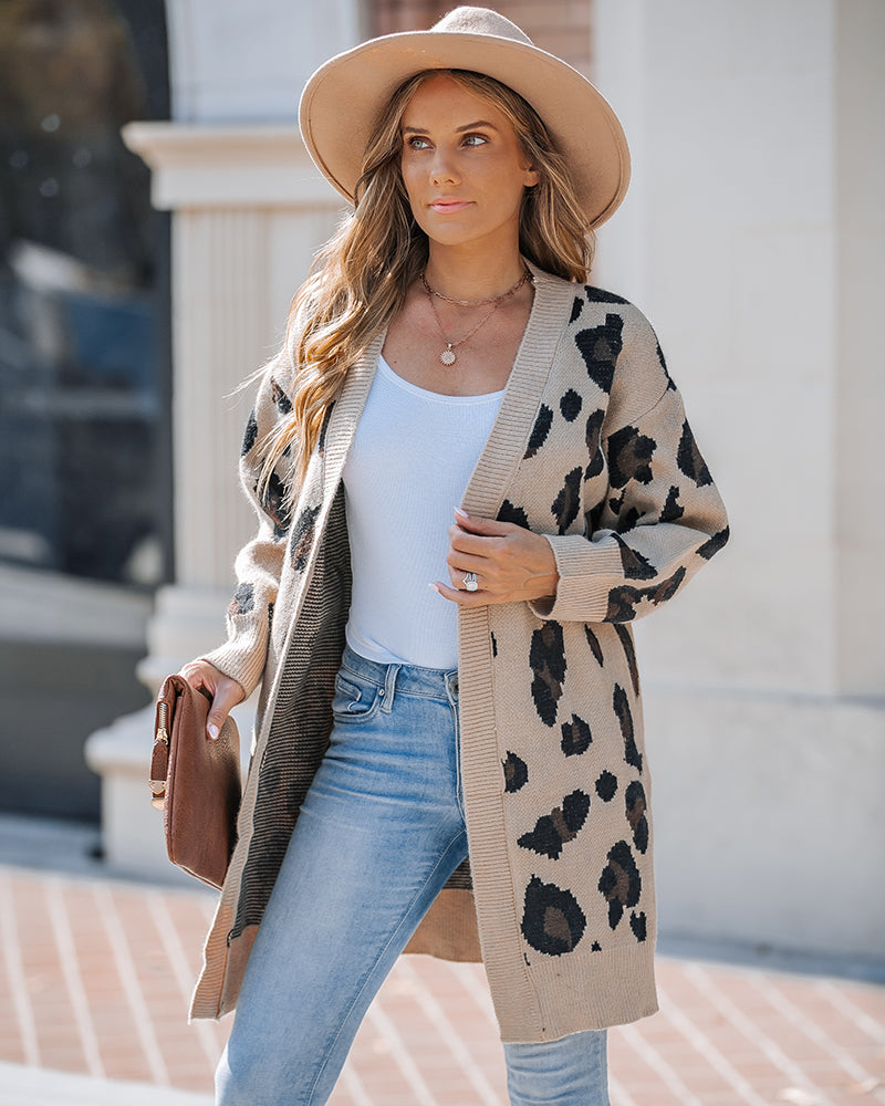 Leopard print longline cardigan with open front, paired with a white top and light blue jeans.
