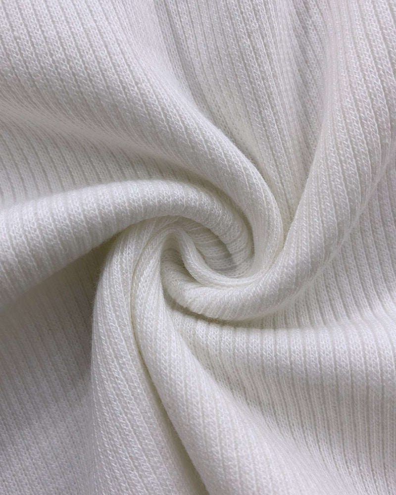 White ribbed V-neck T-shirt with lace-up detail and subtle rhinestone accents visible.