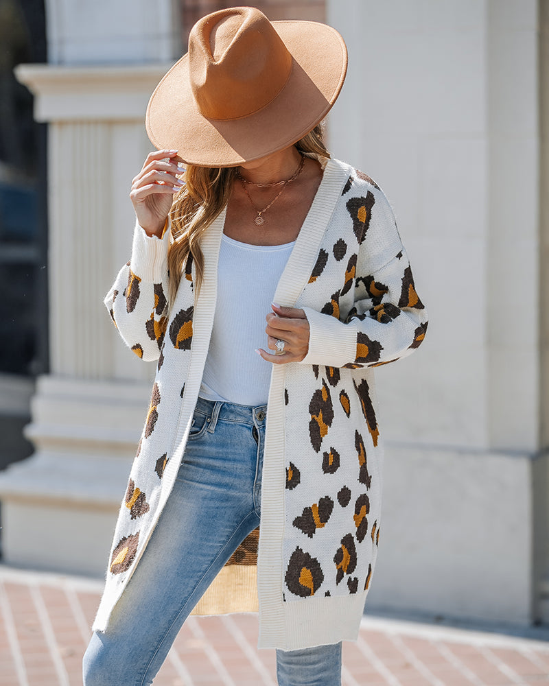 Light blue jeans, white tank top, and KOAD'CLO  Leopard Print Longline Cardigan.