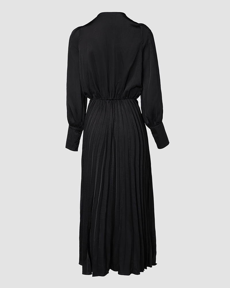 Black elegant maxi dress with puff sleeves, V-neck, pleated skirt, fitted waist, buttoned cuffs.