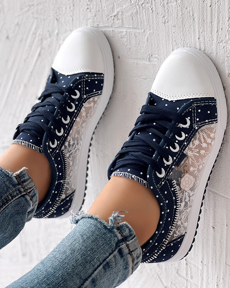 KOAD'CLO  navy floral embroidered polka dot sneakers with white soles and lace accents.