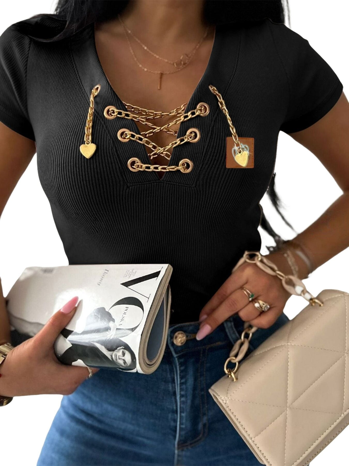 KOAD'CLO's V-Neck T-Shirt with lace-up detail and rhinestone accents and blue jeans.
