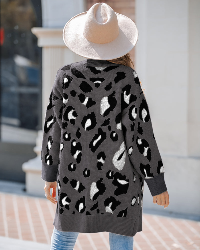 Leopard print longline cardigan with an open front, paired with blue jeans.