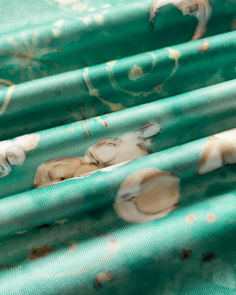 Turquoise sleep dress with playful pastel animal and nature prints, lace patch, and bowknot.