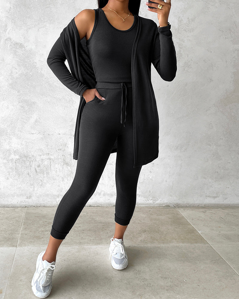 Black KOAD'CLO 3-piece lounge set with tank top, long sleeve coat, and pants.
