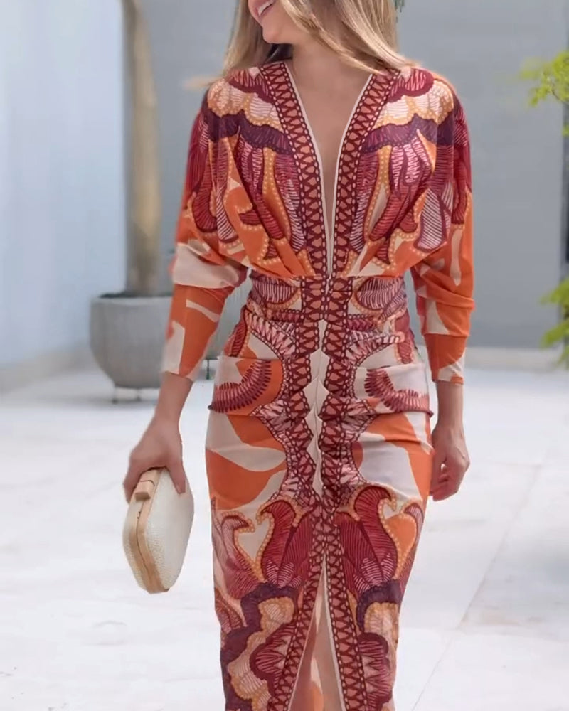 Baroque-inspired deep V-neck bodycon dress with long sleeves and a thigh-high slit.