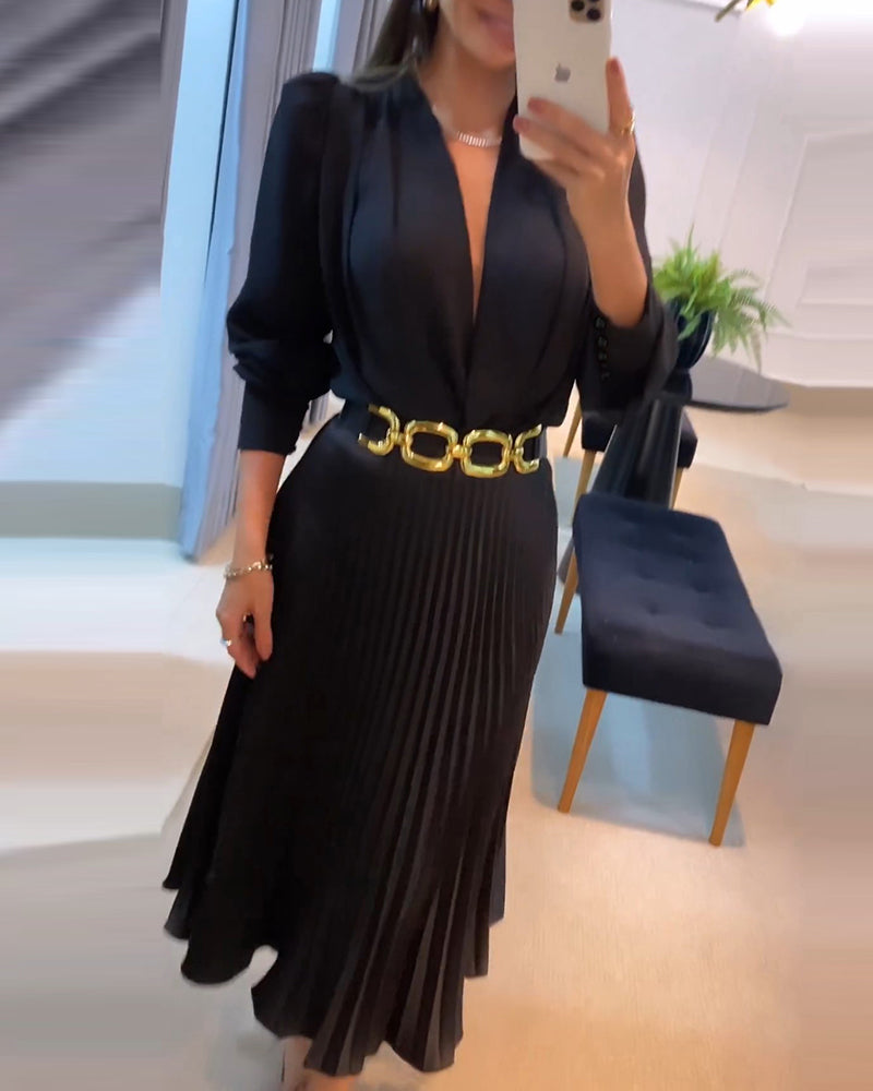 An elegant puff sleeve V-neck pleated maxi dress with flowing silhouette and refined style.