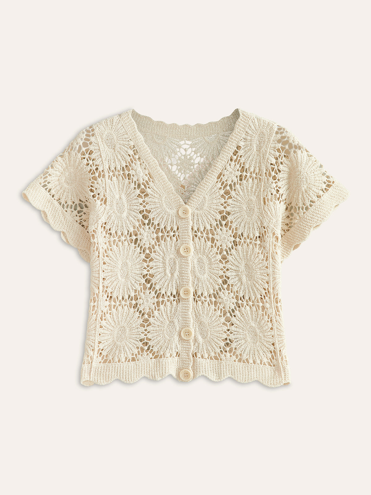 Cream floral crochet cardigan with short sleeves, V-neck, scalloped trim, and five-button front.
