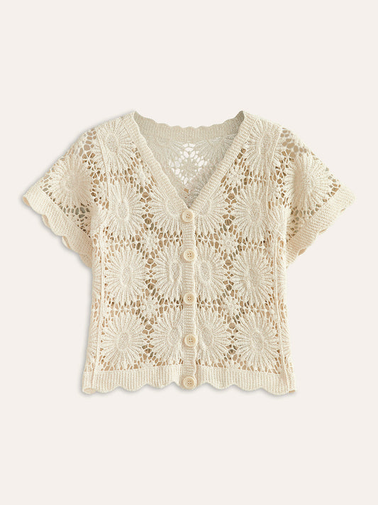 Cream floral crochet cardigan with short sleeves, V-neck, scalloped trim, and five-button front.