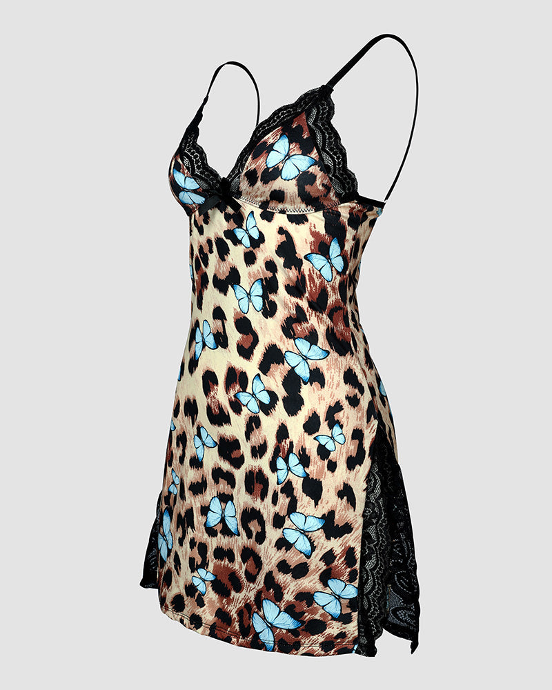 A leopard print sleep dress with butterfly bows, black lace trim, and side slits.