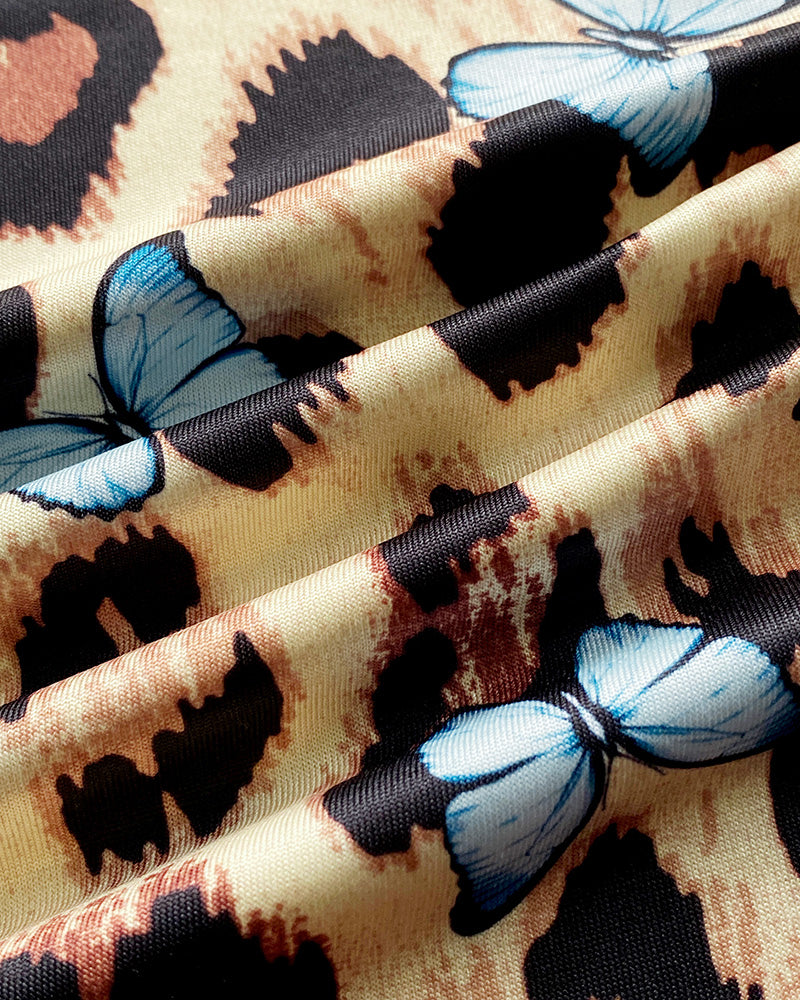 Leopard print sleep dress with blue butterflies, lace trim, and soft textured folds.