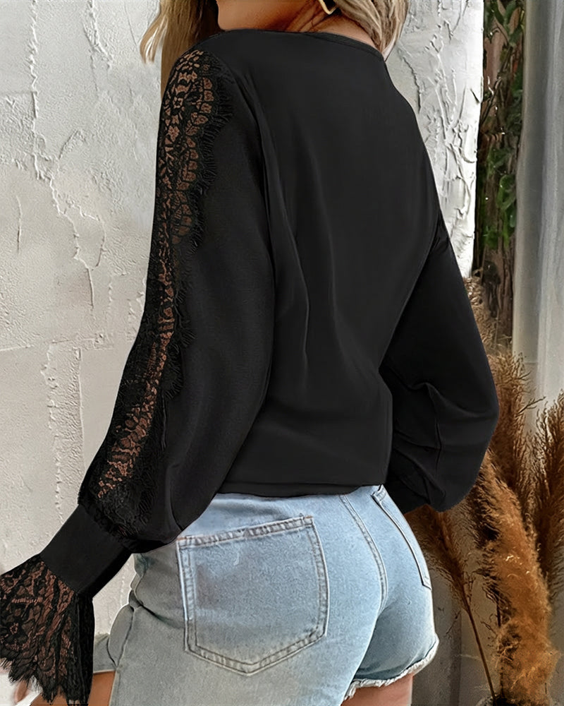 Black KOAD'CLO  V-neck button-down top with eyelash lace, ruffle details, and light blue denim shorts.