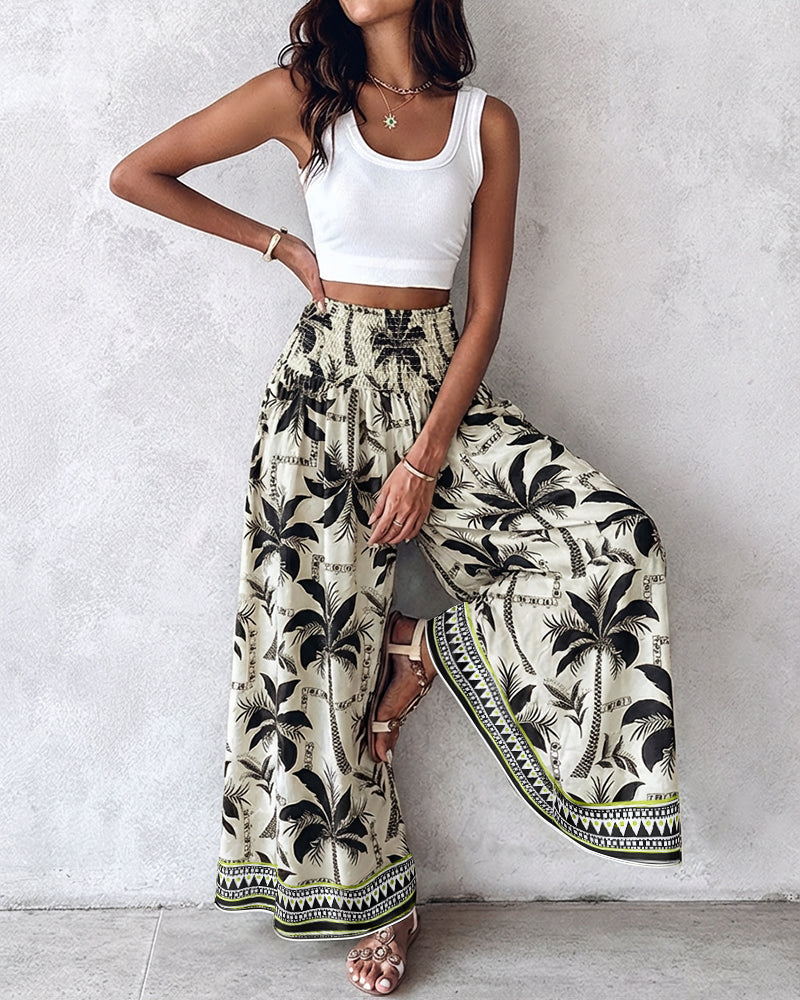 KOAD'CLOKOAD'CLO vintage floral high waist wide leg pants with black palm tree print.