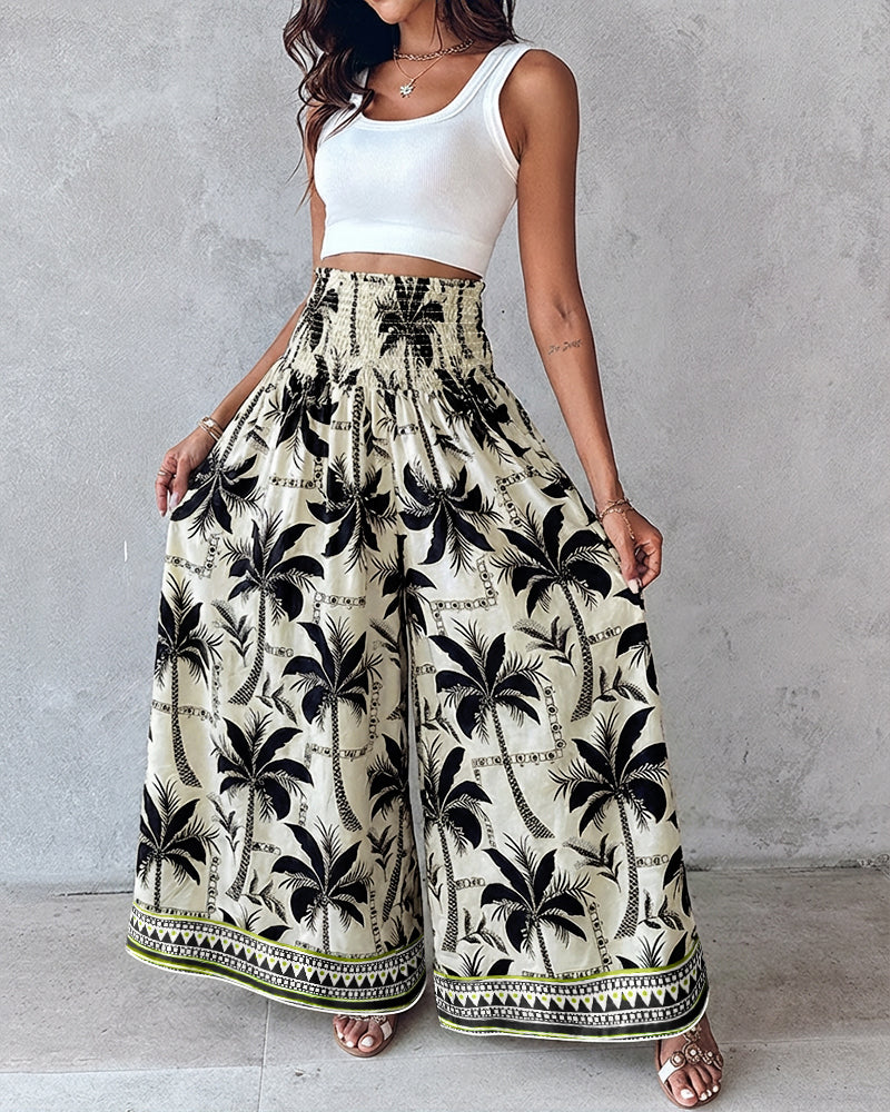 High waist wide leg pants with a white base, black palm trees, and decorative border.