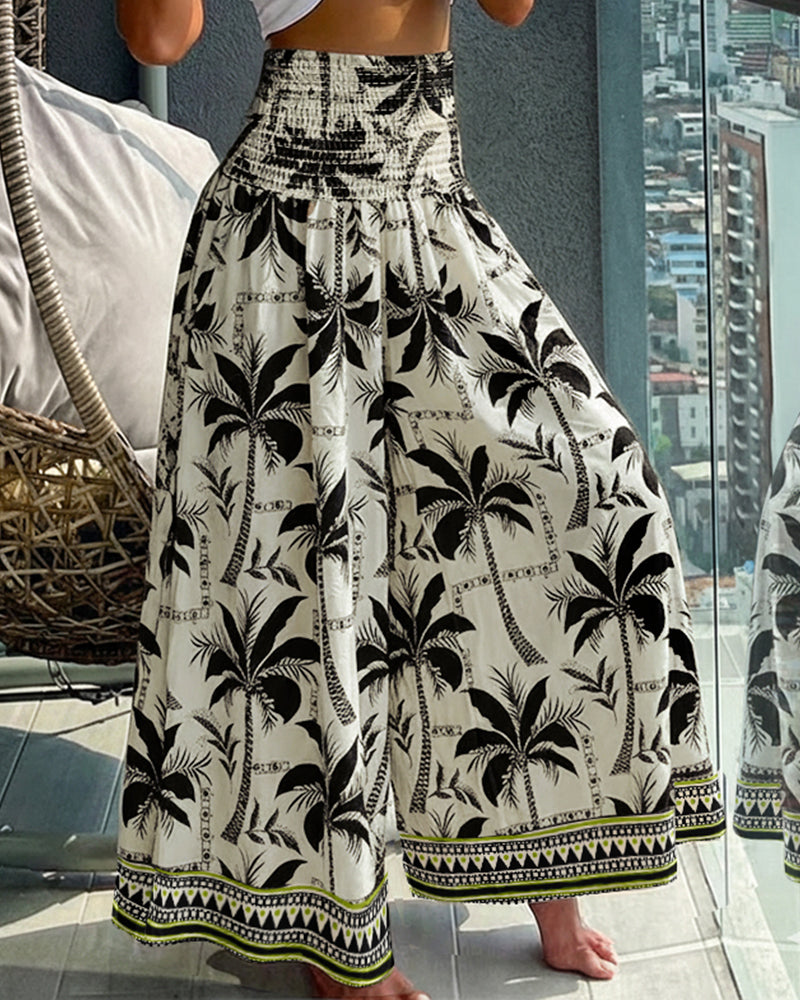 KOAD'CLOKOAD'CLO Vintage Floral High Waist Shirred Wide Leg Pants with a delicate floral pattern.