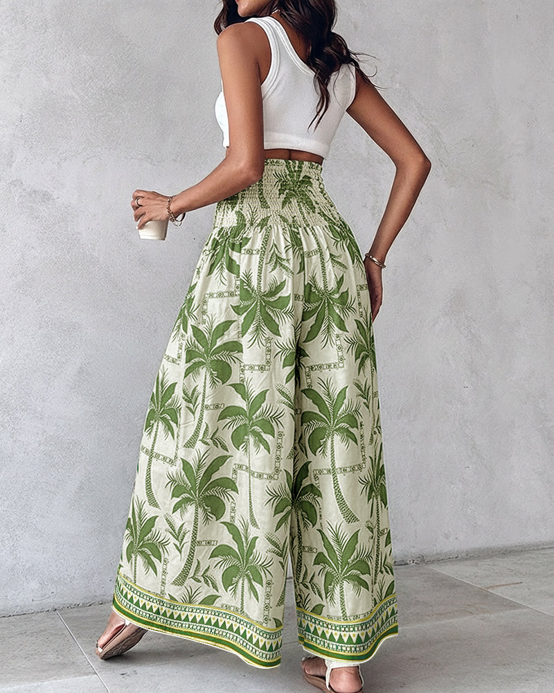 White sleeveless crop top paired with KOAD'CLOKOAD'CLO vintage floral high waist shirred wide leg pants.